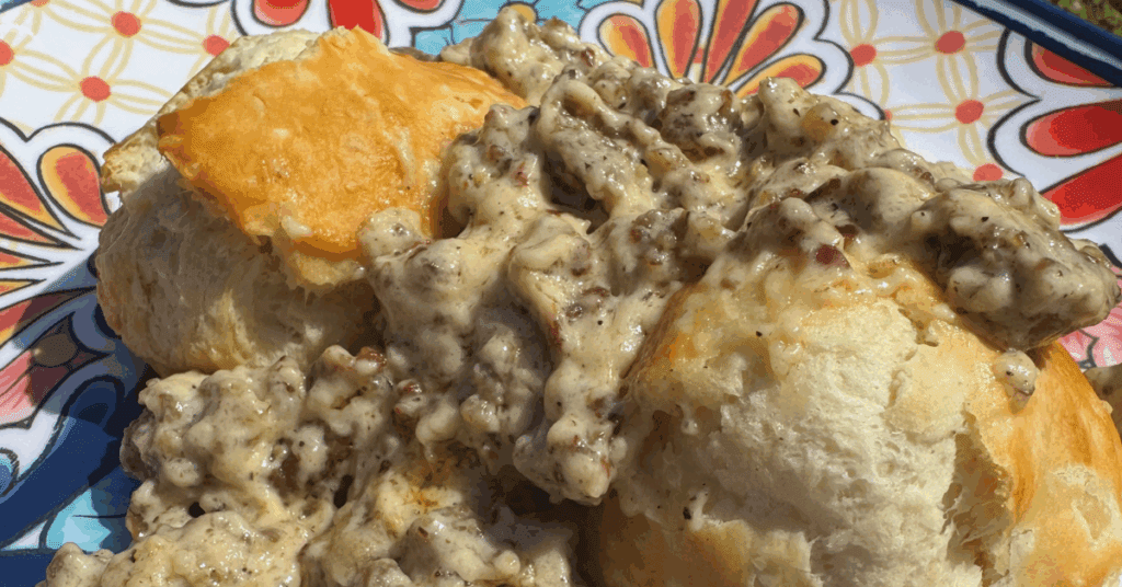 biscuits with sausage gravy on a colorful plate