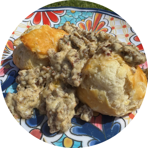 biscuits with sausage gravy on a colorful plate