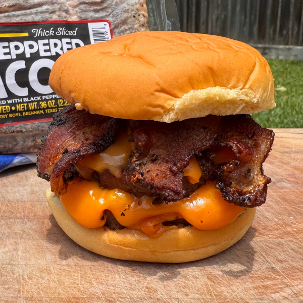 smokehouse bacon cheeseburger on a cutting board