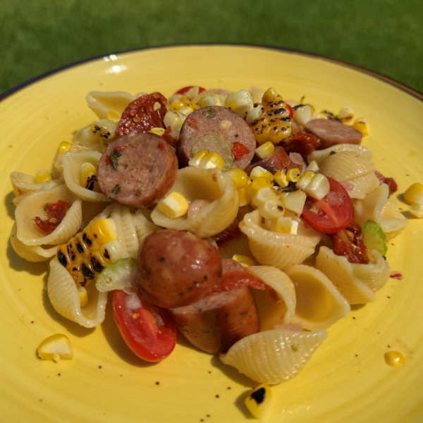 sliced Kountry Boys Original Sausage browned in a skillet for pasta salad